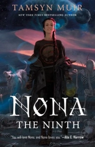 Nona in the center of a sandy, perhaps desert location, dark blue heavenly light above her. She has two braids, and a silly hamburger shirt beneath a loosely tied jacket. There is a white six legged dog to her left, she is holding a mask in her left hand and there is a skeleton rising on the right, with more bones at her feet. In the night sky are a couple of planet like objects.