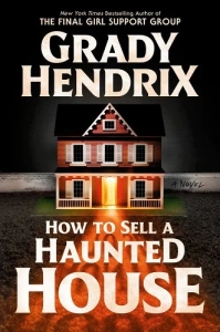 Old school horror cover -- think 80s style. There is a pink two story dollhouse in the center of the cover, on green carpeting, against old white baseboards and grey walls. The house has white shutters and porch railings and gingerbreading. The door is open, casting a baleful yellow tinged light across the carpet, creating a shadow on the title words.
